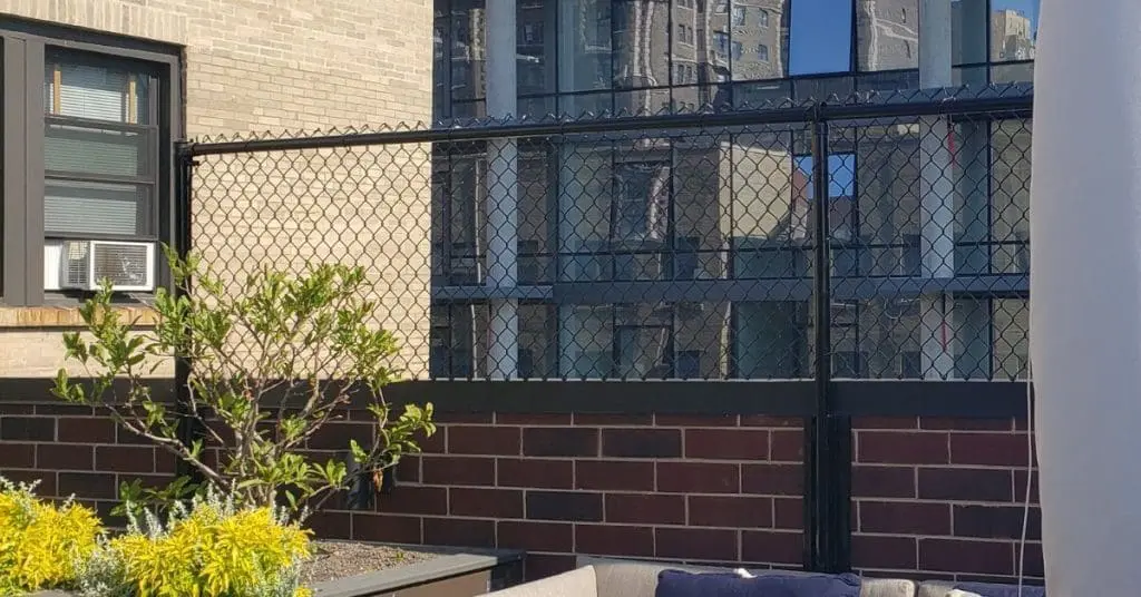 Chain link fence enclosing a residential yard